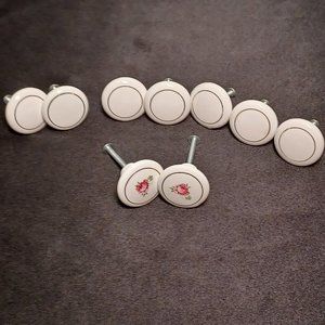 Dressers Knobs, nine white porcelain, 7 white 2 with pink flowers